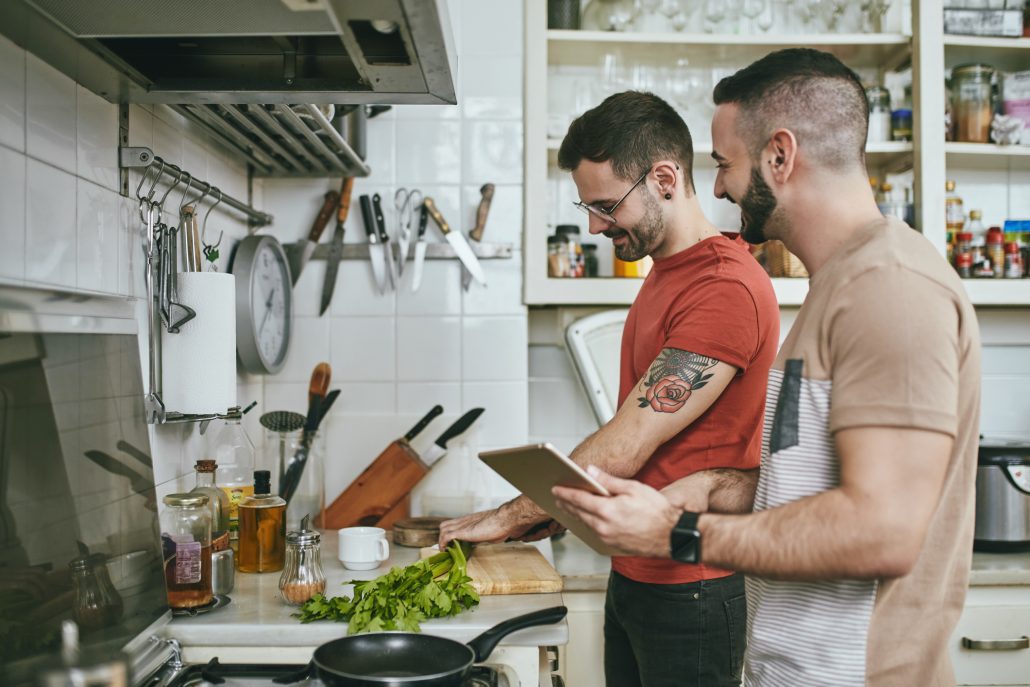 Two men food prepping together.
