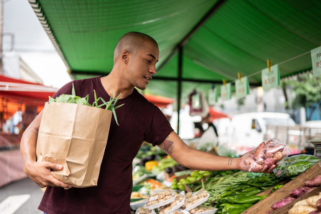 Man shopping at a local farmers market.