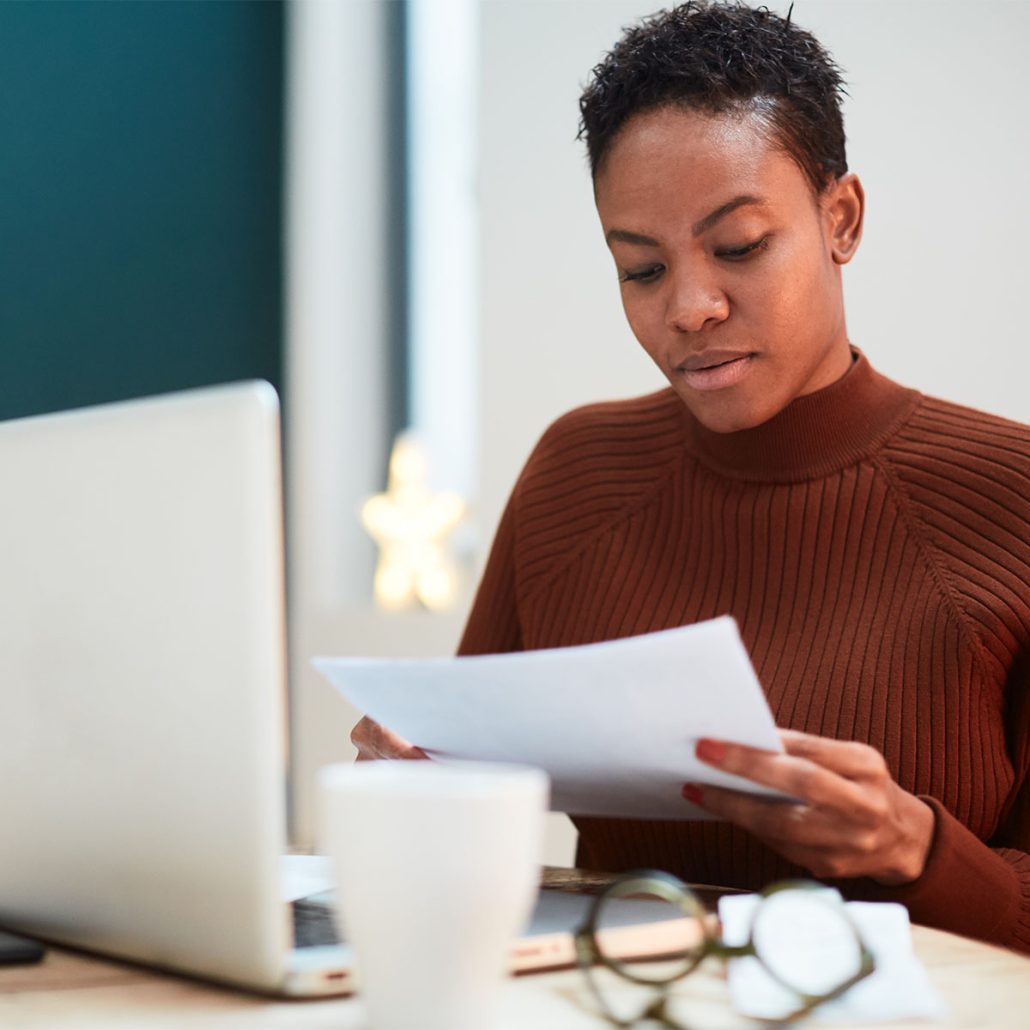Woman reading and doing paperwork.