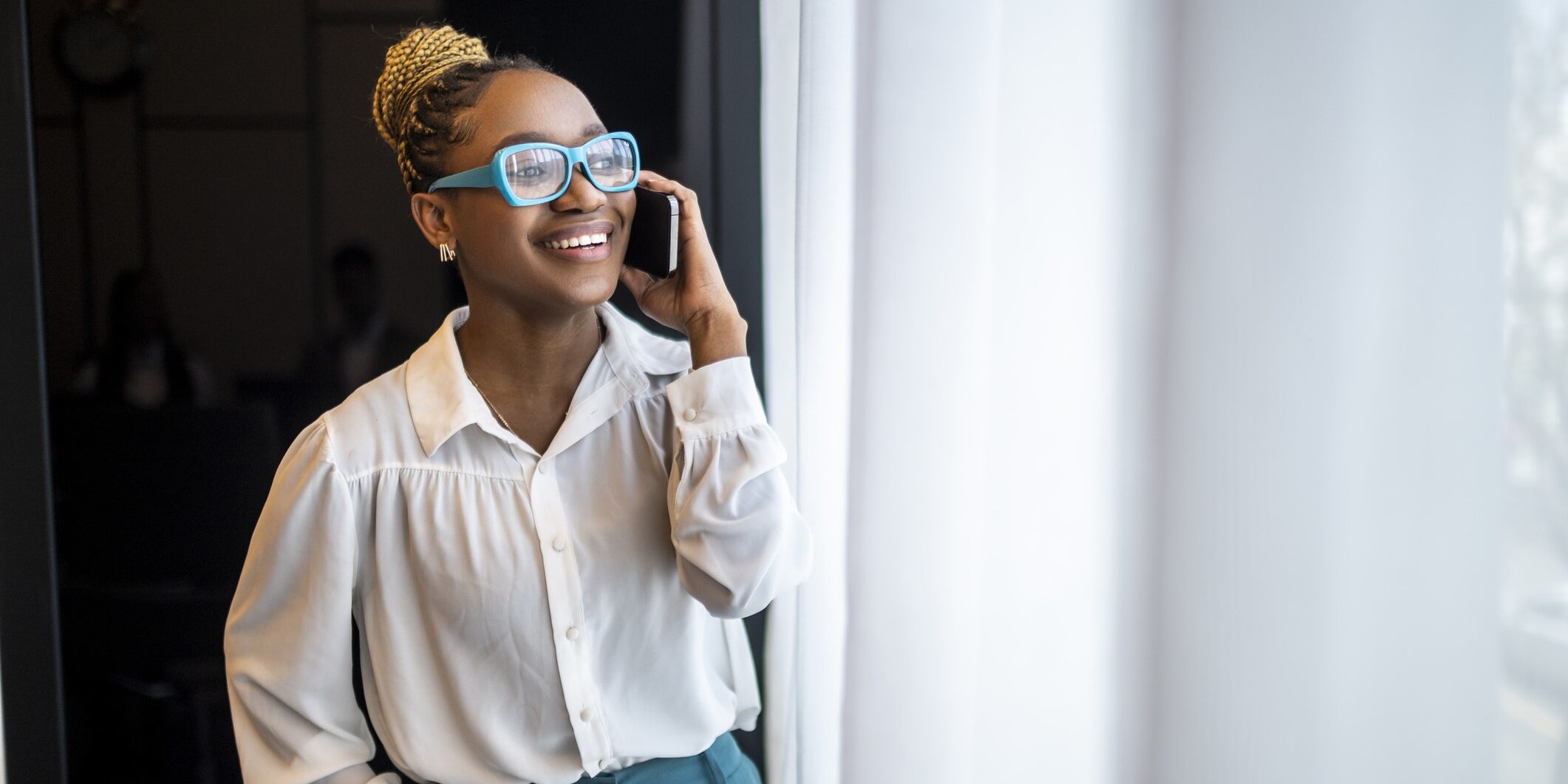 Woman on the phone discussing compliance.