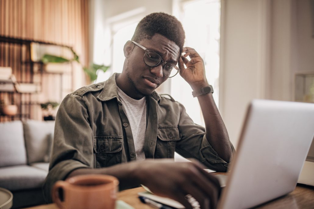 Man working on laptop at home