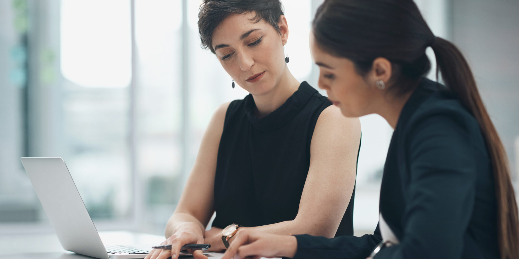 Businesswoman, team and pointing at document in office for reading, report or review in customer care. People, together and partnership for talk, collaboration and strategy for future, growth or sale